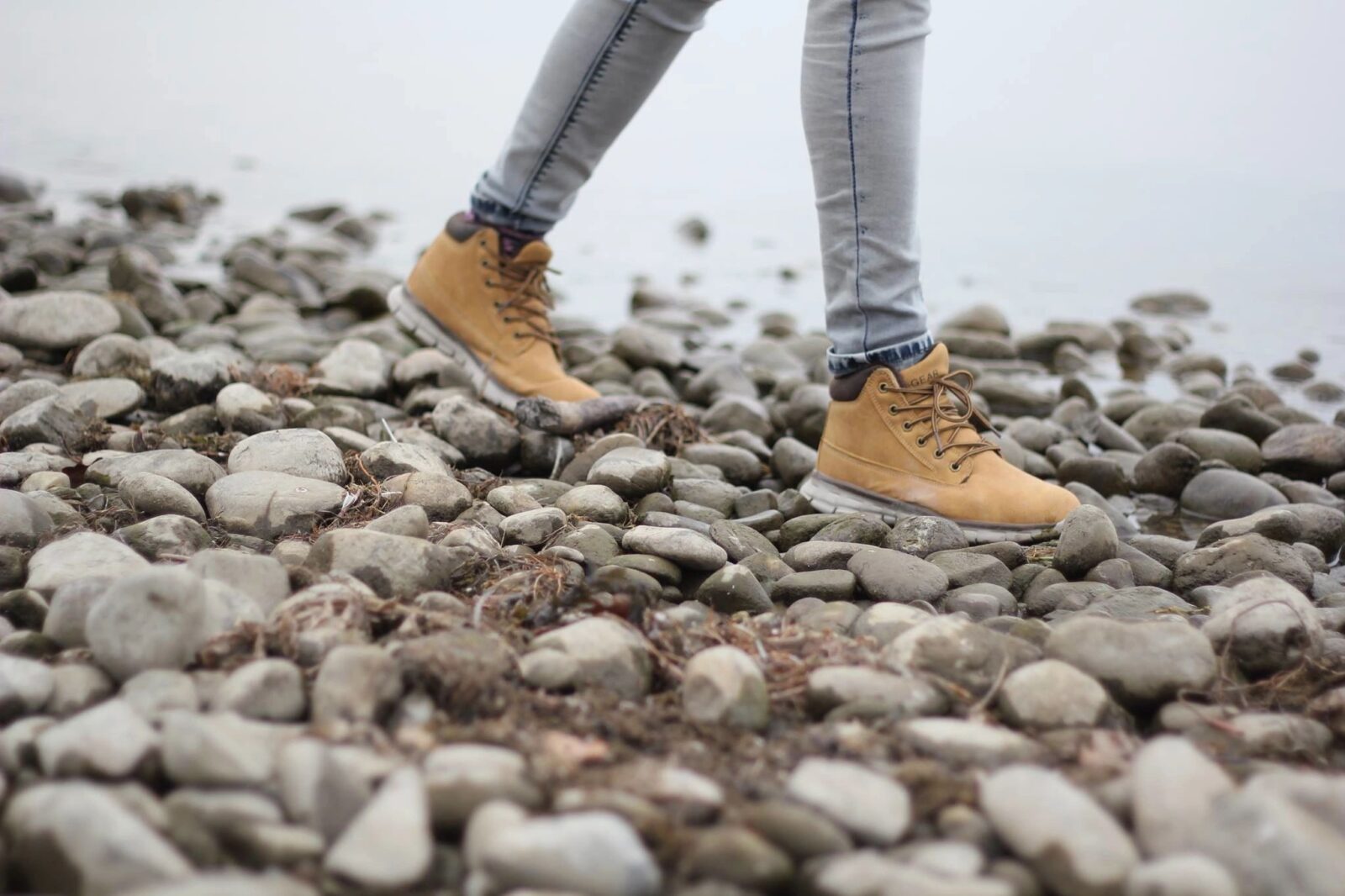 photo of person walking on the ground